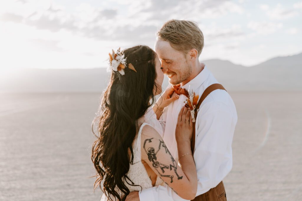 Bride and groom lovingly embrace each other at the Alvord Desert
