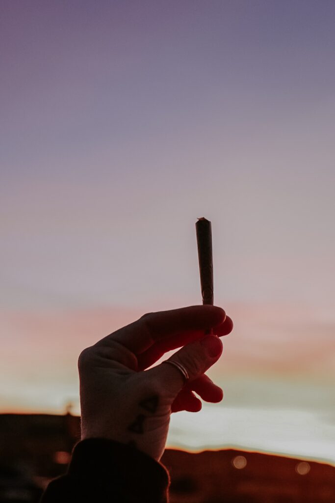 Summer sunset with cannabis joint 
